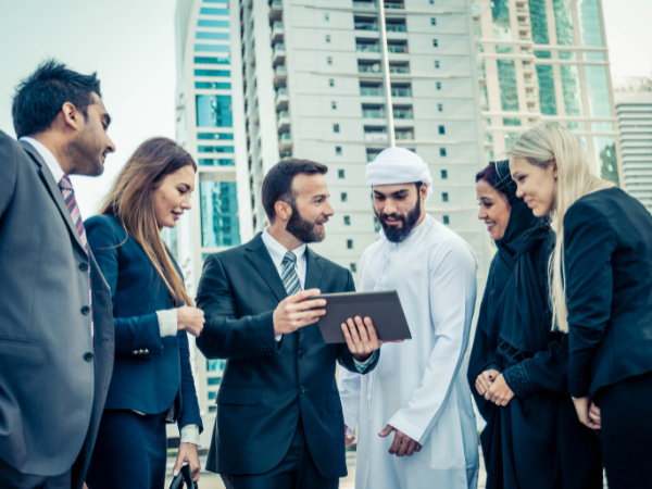 Multiethnic group of business people meeting outdoors in dubai