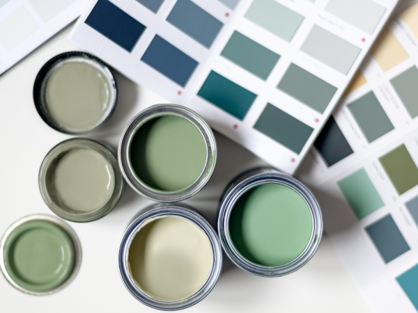 Paint colour samples in earthy greens, blues, and whites