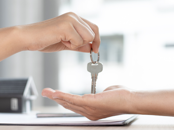 Tenant receiving the key to a rental property