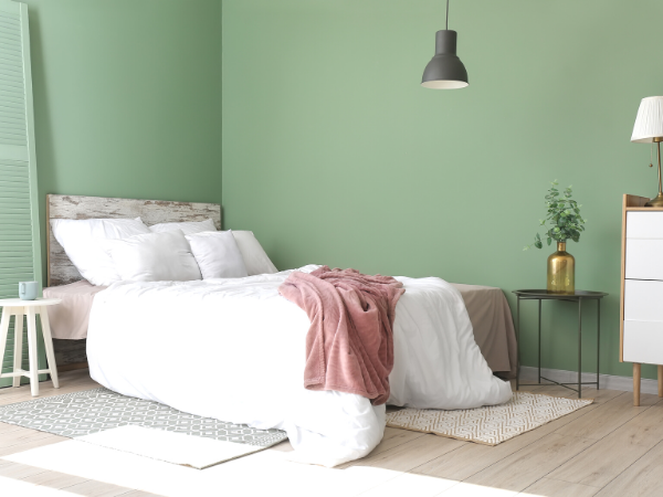 bedroom in muted green colour