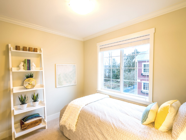 bedroom in pastel yellow colour