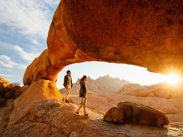 father and daughter exploring Spitzkoppe in Namibia at sunrise 
