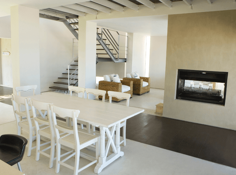 white open space dining room fireplace