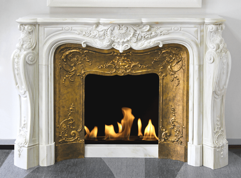 Gold and white traditional fireplace