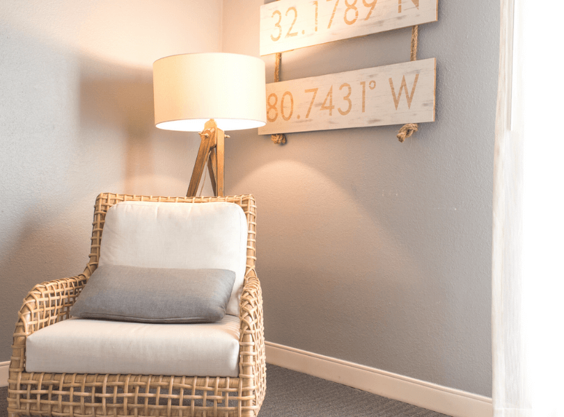 cream coloured lamp and chair