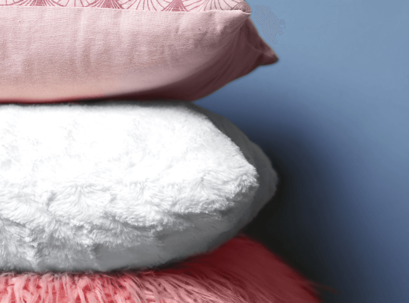 light pink and white throw pillows