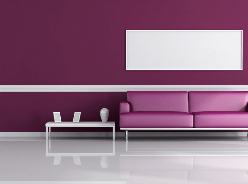 purple wall and purple couch with white decorations