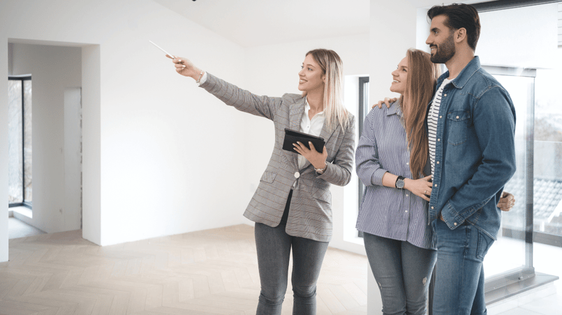 real estate agent speaking with couple