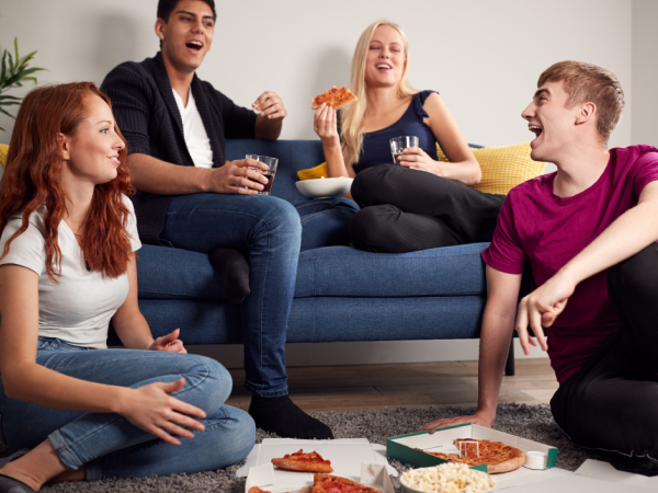 students having their first dinner in their new rent-to-buy home 