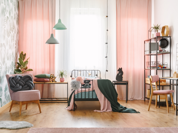 teenagers modern bedroom in pink, green, and white, with living space and minimal furniture
