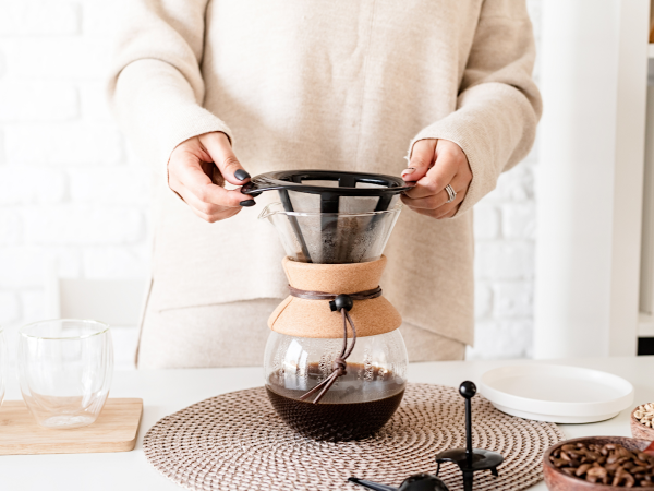 woman brewing coffee